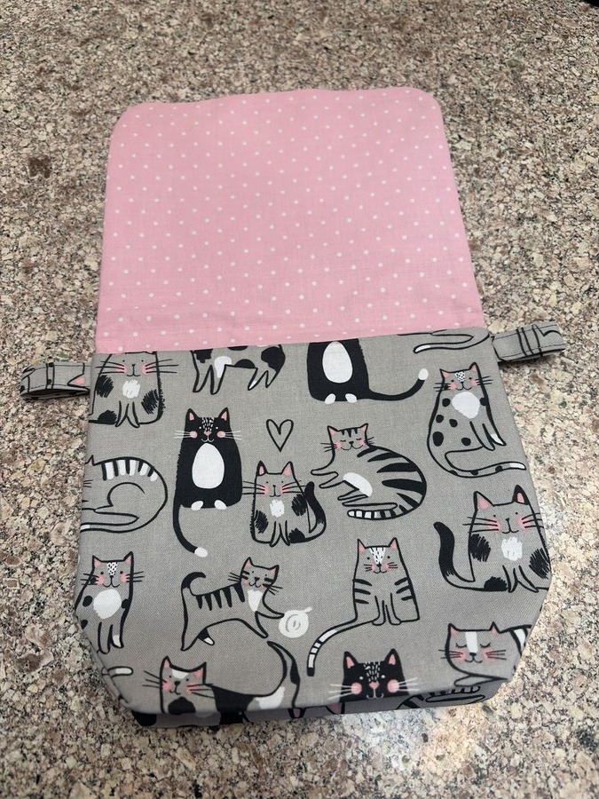 Gray cats with pink polka lining